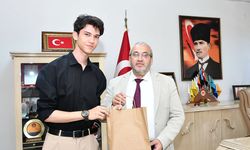 Türkiye birincisi Mustafa Aslan’dan Müdür Çağlar’a ziyaret