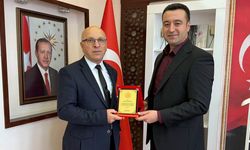 Mehmet Erdemli’ye emeklilik plaketi