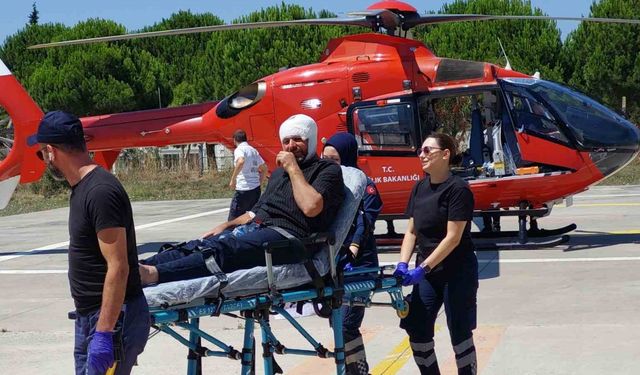 Kafasına harç makinesinin demiri çarpan şahsın yardımına ambulans helikopter yetişti